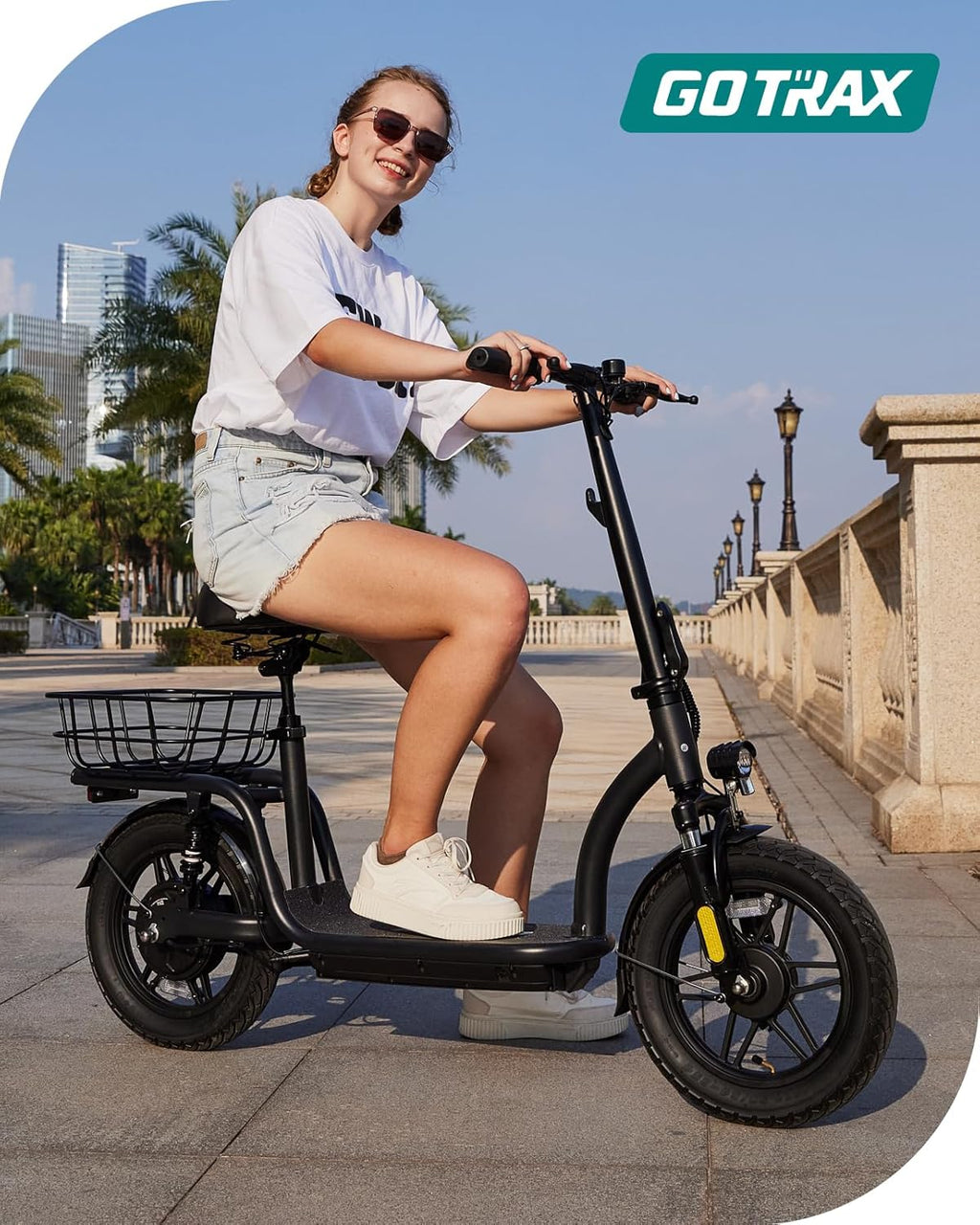 Gotrax adult electric scooter with seat maximum range of 19-25 miles all-terrain tires wide pedals wourant