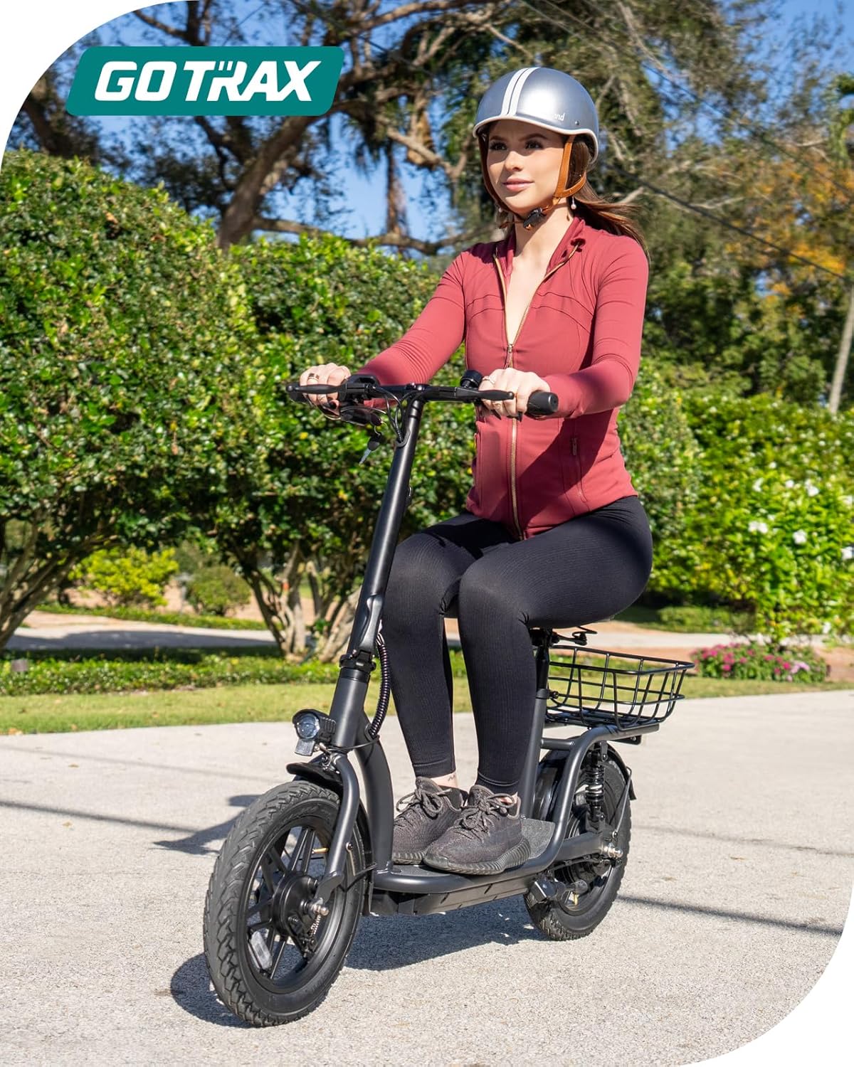 Gotrax adult electric scooter with seat, maximum range of 19-25 miles, all-terrain tires, wide pedals, padded seat, and carrycot wourant