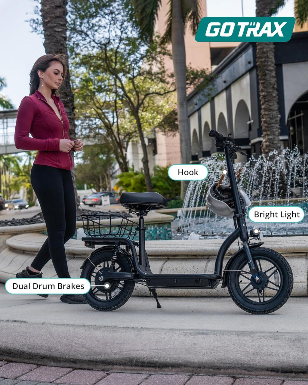Gotrax adult electric scooter with seat, maximum range of 19-25 miles, all-terrain tires, wide pedals, padded seat, and carrycot wourant