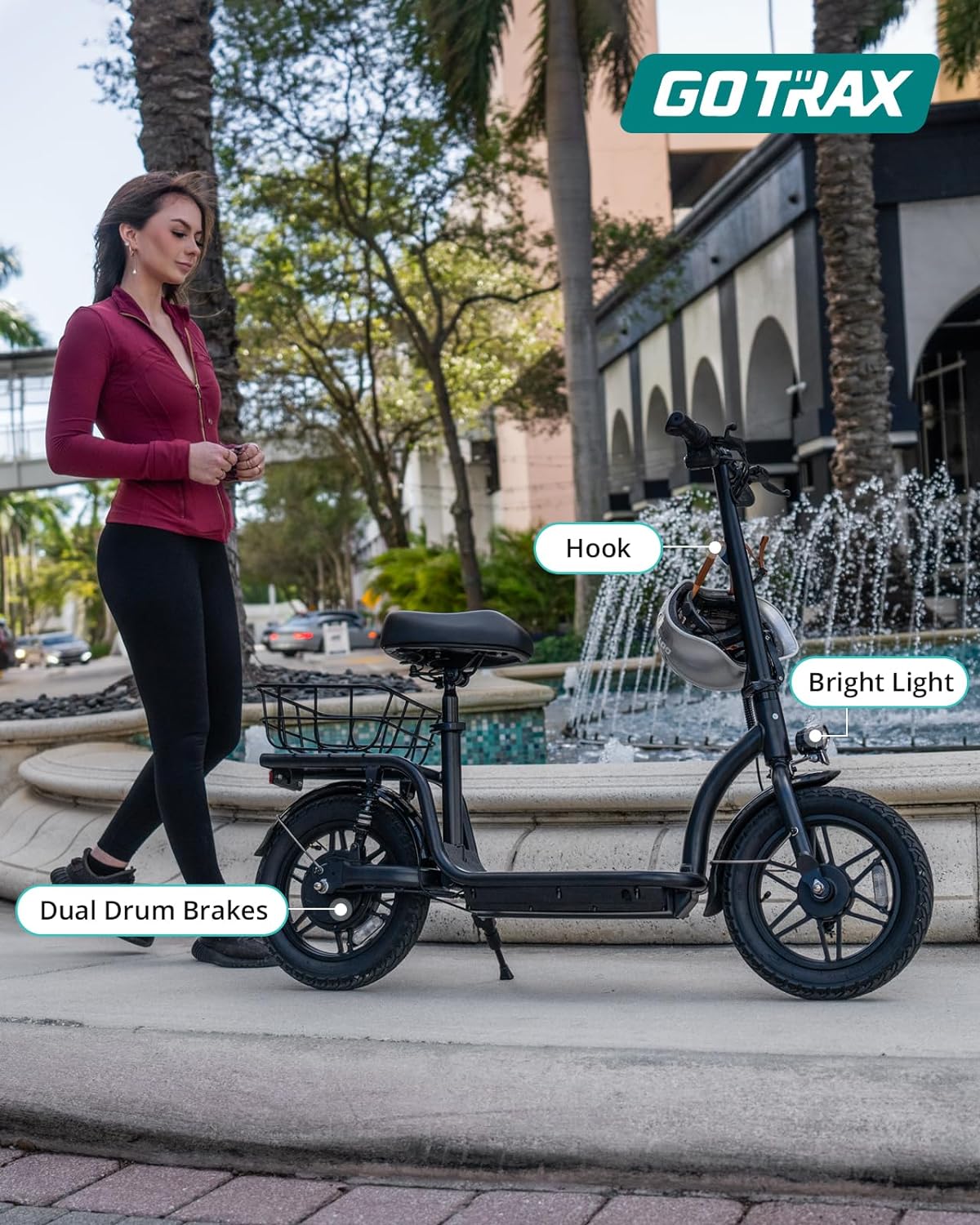 Gotrax adult electric scooter with seat, maximum range of 19-25 miles, all-terrain tires, wide pedals, padded seat, and carrycot wourant
